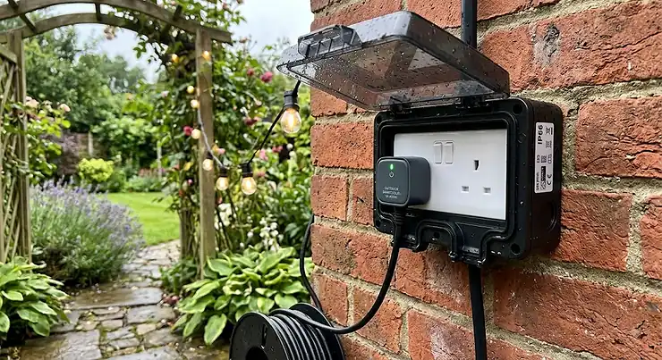 Weatherproof dual garden socket with IP66 cover showing the best outdoor smart plug for British gardens