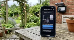 Smartphone screen displaying voice assistant setup for an outdoor smart plug connected to a home network